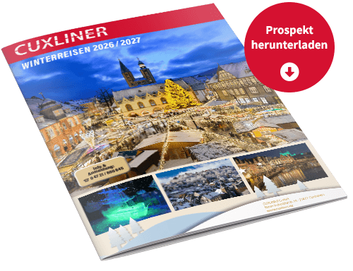 Jetzt Prospekt Winterreisen 2026 / 2027 herunterladen! Das ist ein Mockup. Es zeigt eine Broschüre. Auf dieser Broschüre sieht man einen Weihnachtsmarkt auf einem historischen Platz mit vielen Lichtern. Es steht „Winterreisen 2026 / 2027“ auf der Broschüre. In einem kleinen Kreis daneben steht „Prospekt herunterladen“.